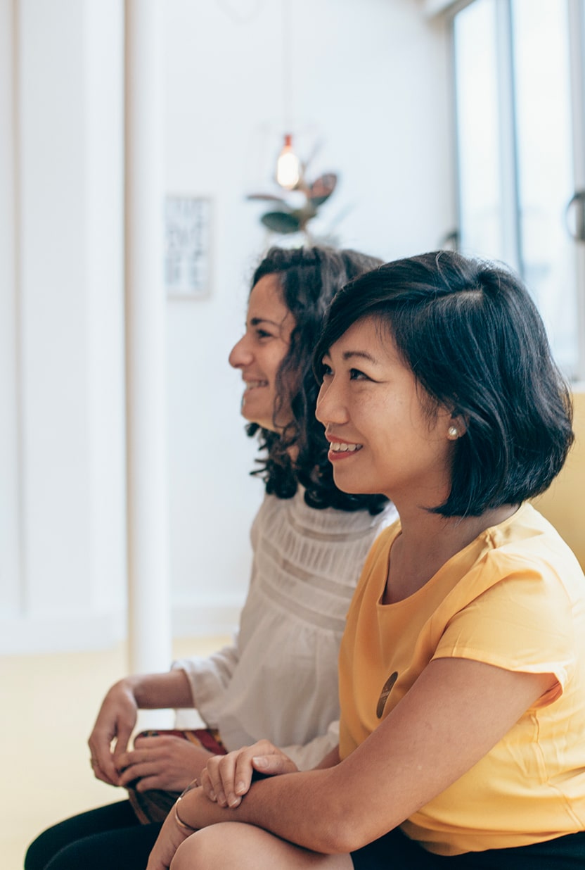 Two smiling people side by side.