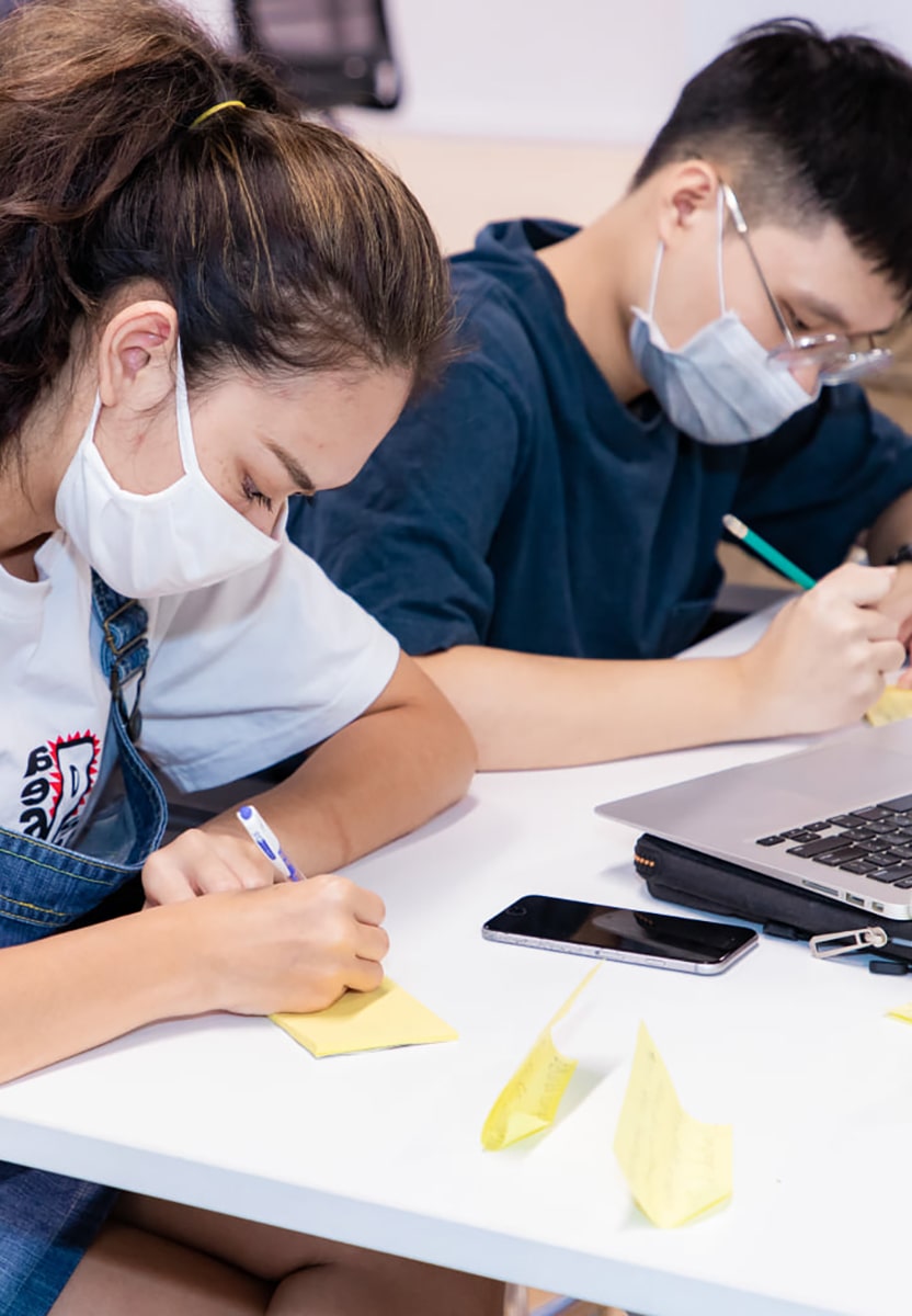 Two students working on a project together