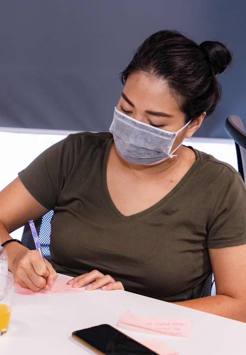 A woman working on an impact project