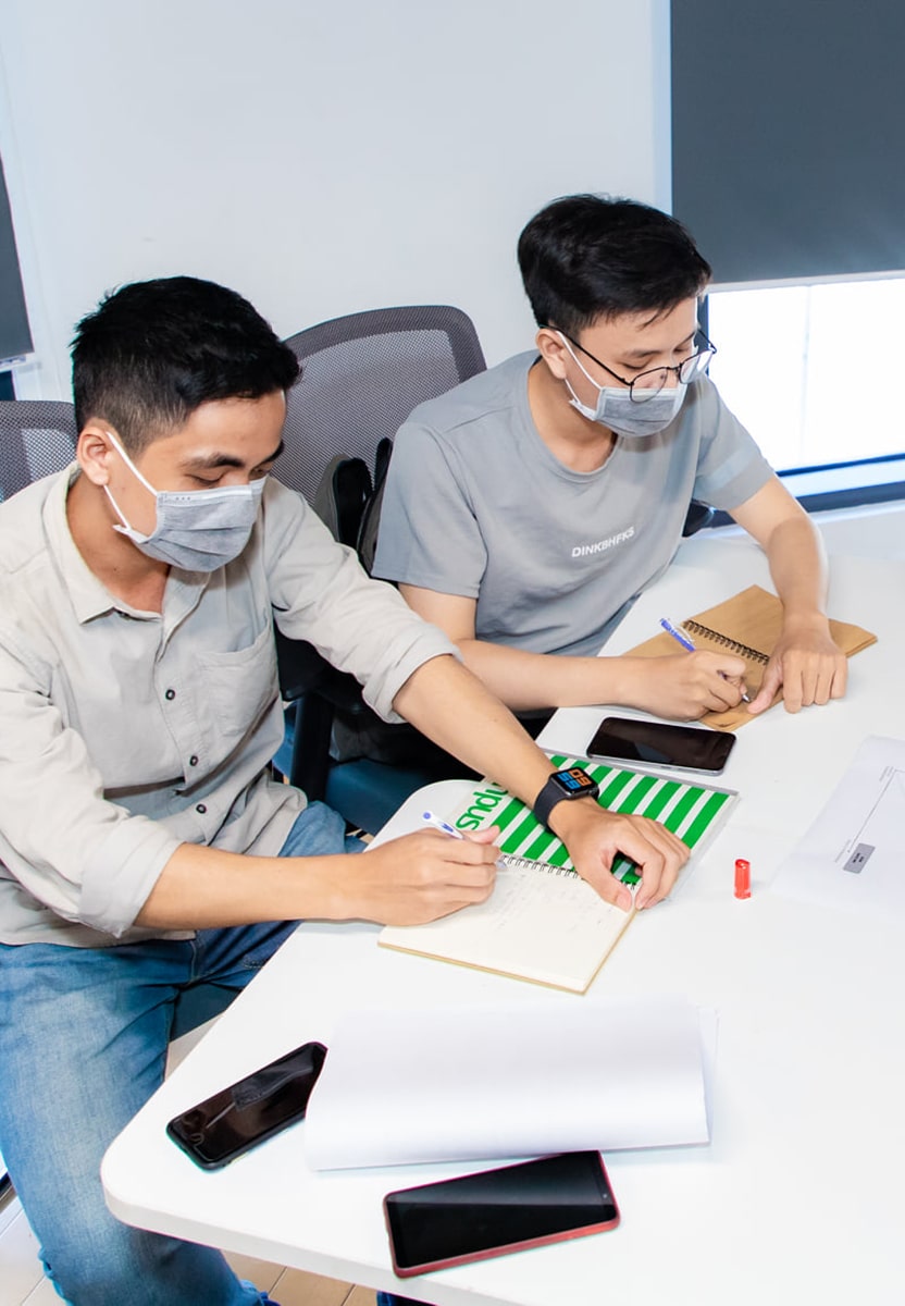 Two Schoolab team members working on a strategy project